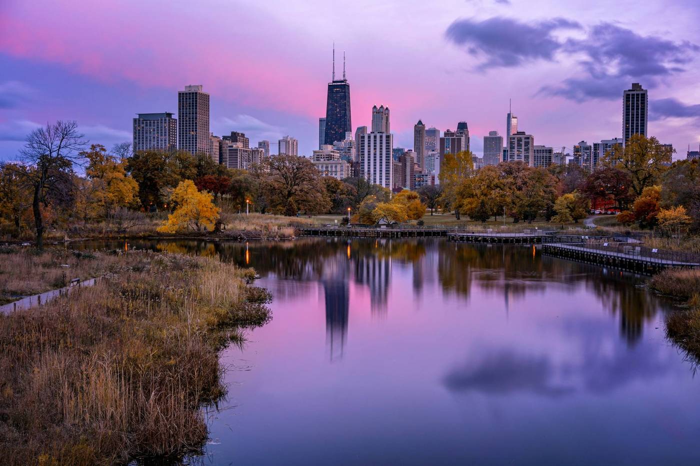 Chicago skyline at dusk over the Lincoln Park pond
